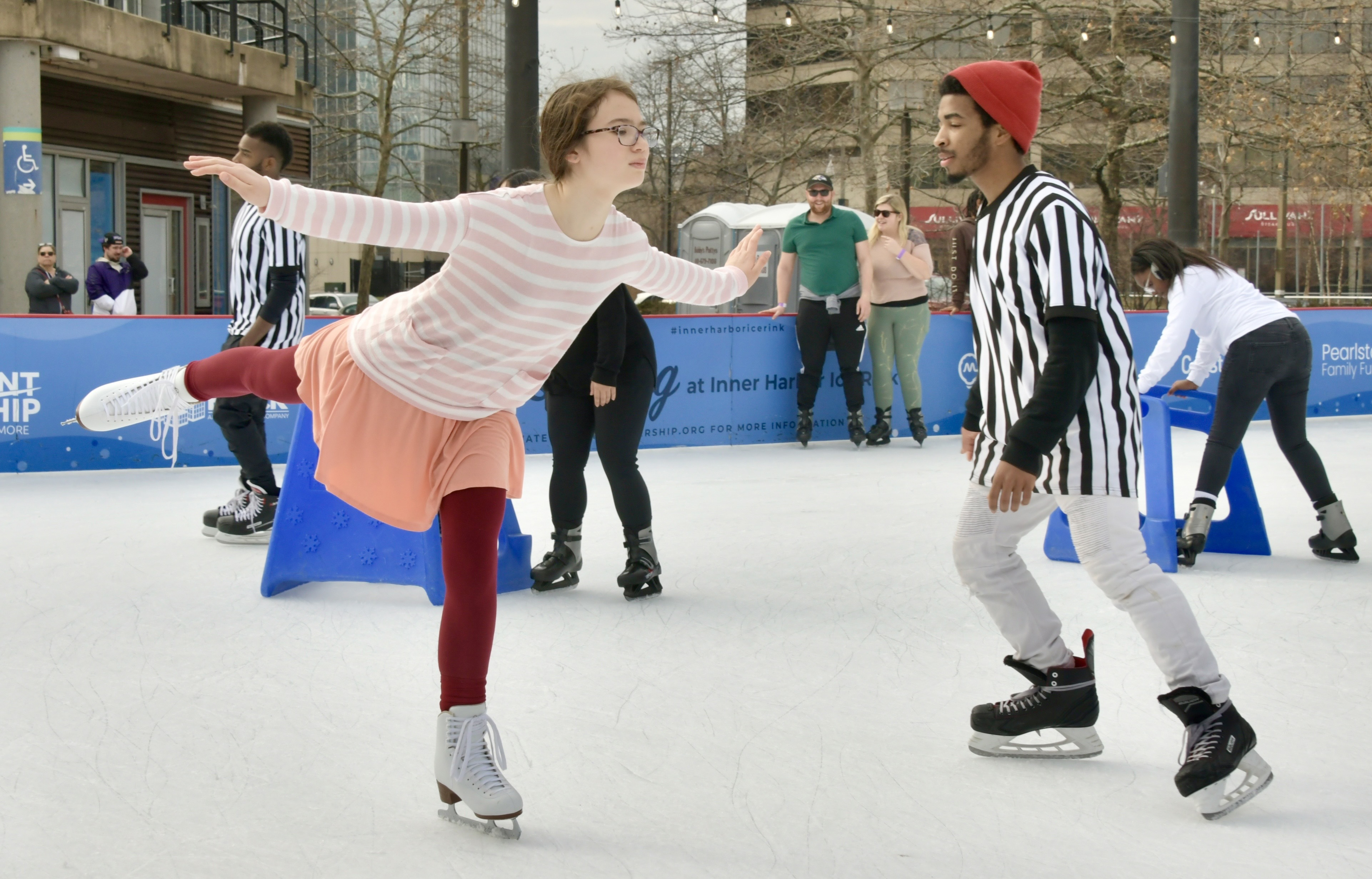 Natalie Berry, 13, of Baltimore, left, practices her spirals at the Inner Harbor Ice Rink.